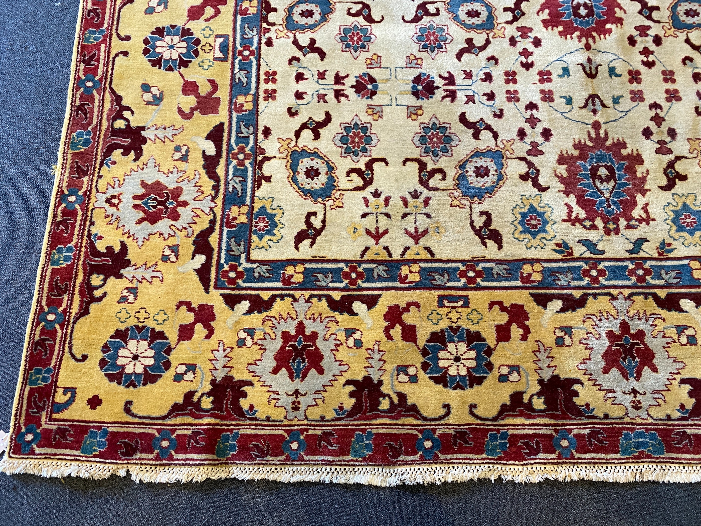 An Agra ivory ground carpet, 360 x 274cm